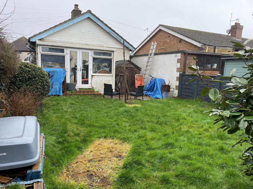 Lot: 65 - DETACHED BUNGALOW IN NEED OF UPDATING - View of rear elevation with lawn